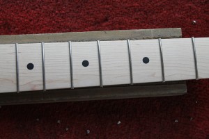 The fret ends have been clipped short using pincers