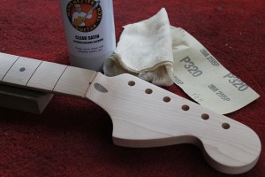 Preparing the neck by sanding and sealing with clear lacquer