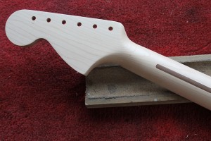 The Stratocaster has a soft V profile at the first fret.