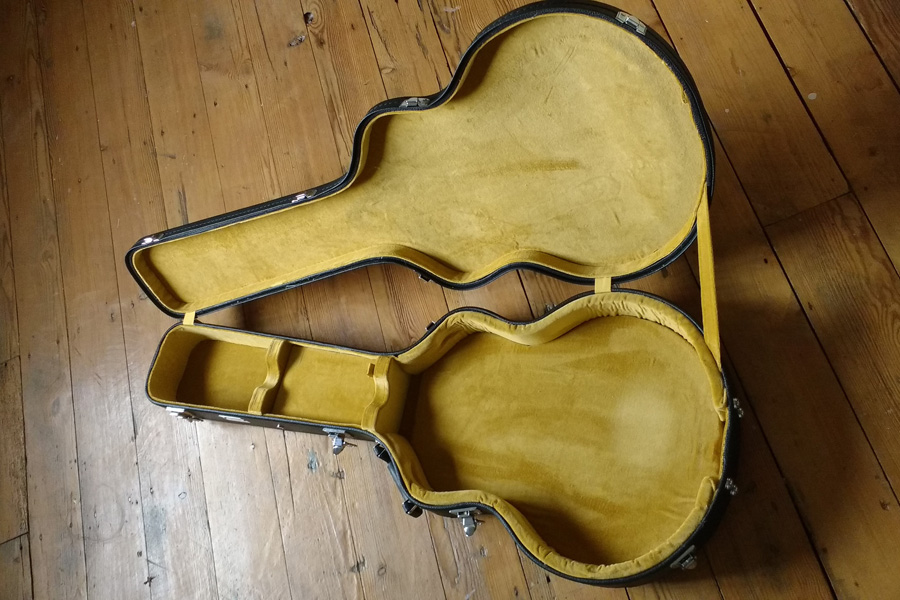 Spider guitar case relined with yellow velvet